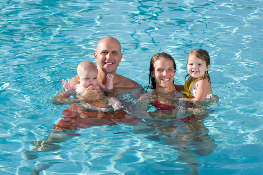 A family enjoying their back yard pool