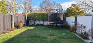 Before a compact back yard pool installation