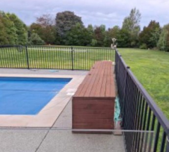 Pool box beside pool fence